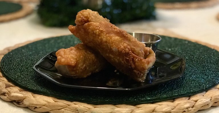 Egg Roll on Black Plate dipping sauce